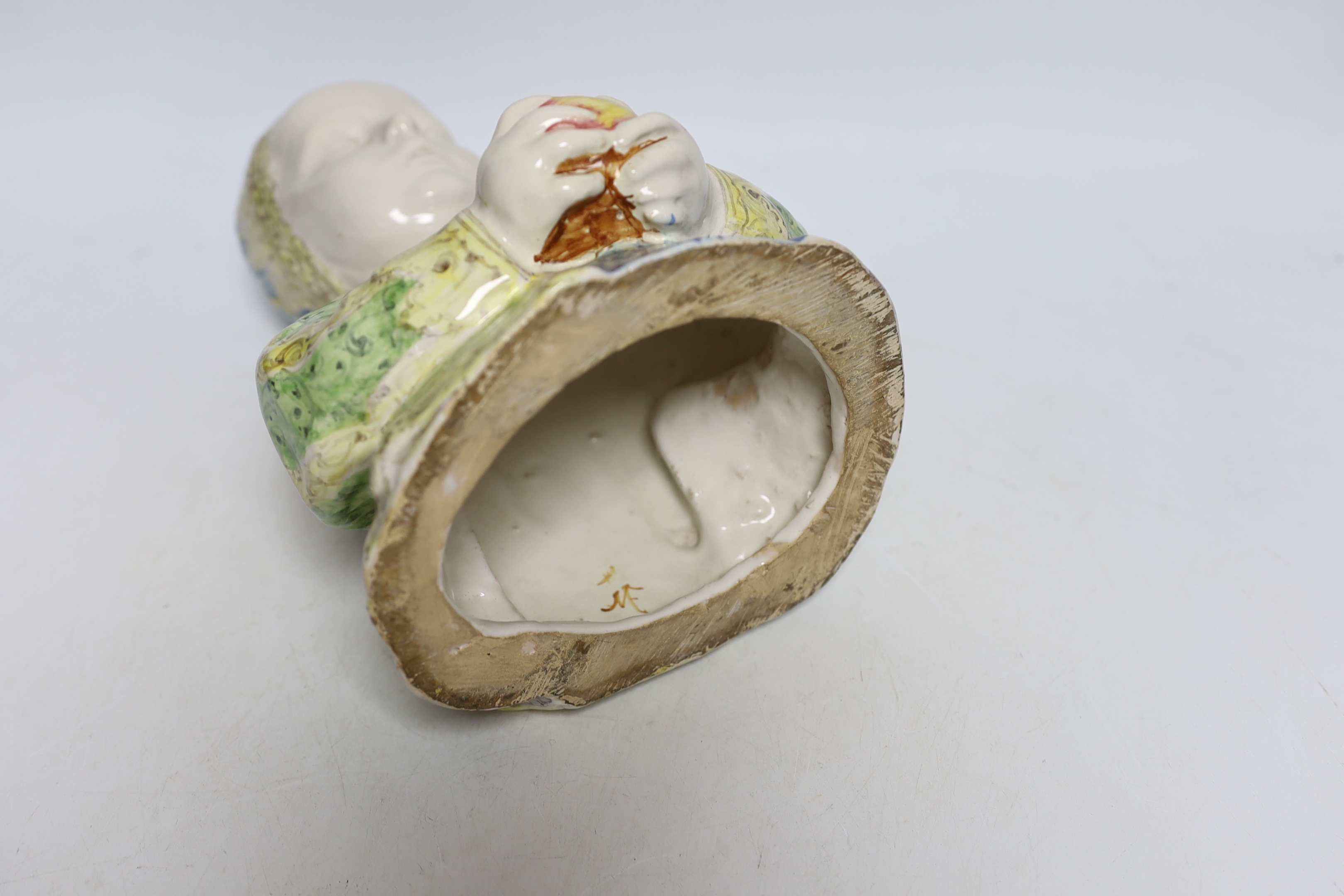 Angelo Minghetti, a late 19th century Italian maiolica Half length model of a Renaissance child holding an apple, 24cm